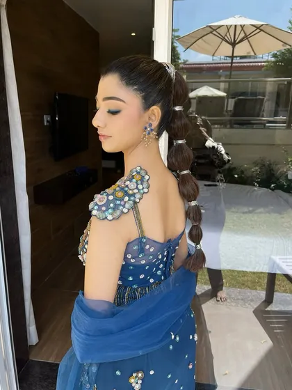 Let's play with themes! This was a fun 'mermaid glam' look for a carnival event. I paired a sharp winged liner and glowing skin with a creative balloon braid to match the whimsical, ocean-inspired fishcut outfit.