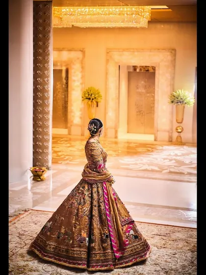 A back view of the Delhi Vintage Co. lehenga, showing how the story unfolds across the fabric. It’s a testament to the incredible craftsmanship of Indian textiles.
