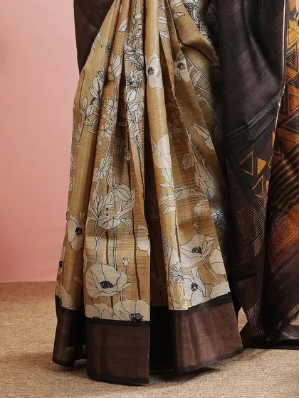 A detailed shot of the floral and geometric prints on the saree, showcasing its unique design.