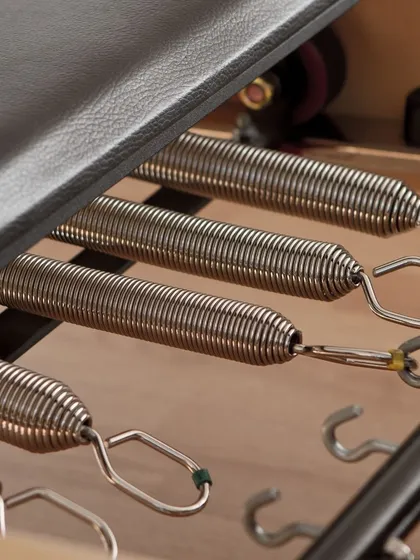 Did you know? The springs are the main source of resistance on the reformer, and they're color-coded for different tension levels.
