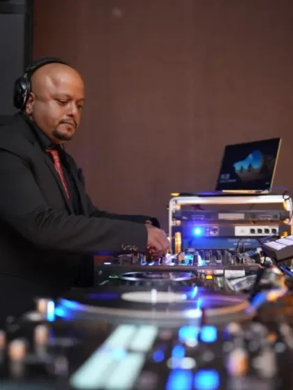 DJ Roland Monteiro on the decks at Luru Christmas. My events feature seasoned DJs who are masters of their craft, ensuring a high-quality music experience.