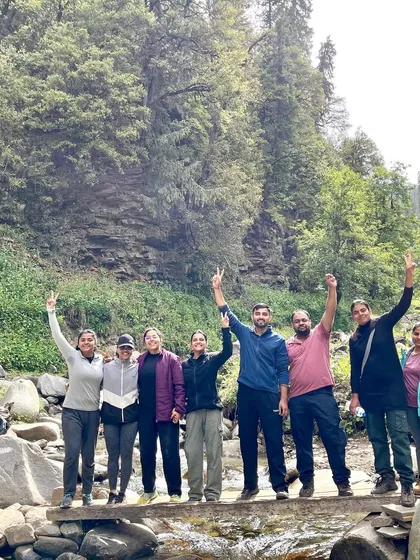 A happy group celebrating on the Bhrigu Lake trek. The camaraderie on the trail is one of the best parts of the experience.