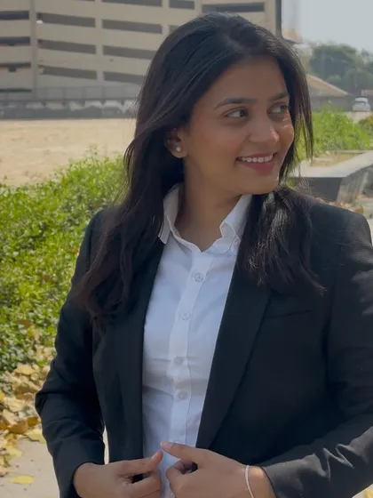 A smiling profile shot. I connect with my clients on a human level, which is essential for effective representation.