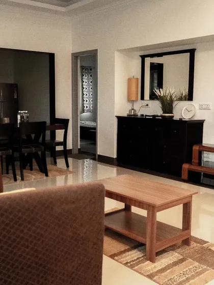 The spacious and modern living room in a private villa, providing a comfortable space for the team to relax together.
