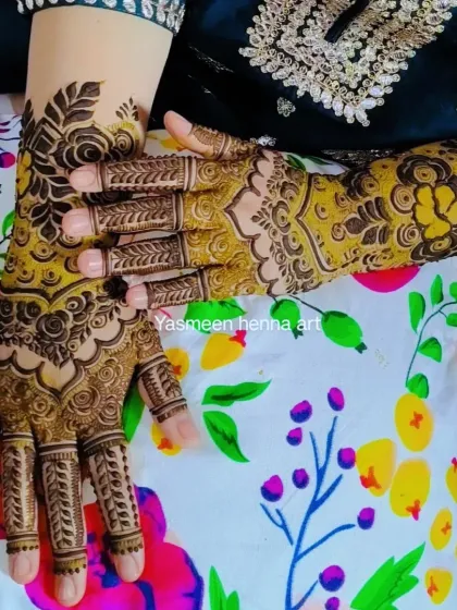 A different pose showing the same beautiful party-style mehndi.