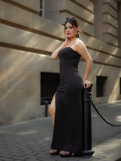 A profile view from the same series, highlighting the model's pose and the dress's silhouette.