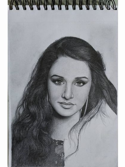 The Shraddha Kapoor sketch halfway through. This shows the contrast between the rendered hair and the blank paper, a reminder that every part of the drawing is built from nothing.
