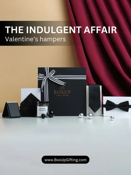 'The Indulgent Affair' is a classic and stylish Valentine's hamper, featuring a sophisticated black and white theme with a bow tie, pocket square, and other elegant accessories.
