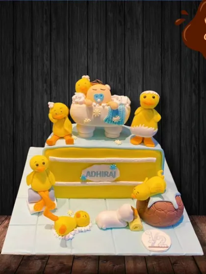 Celebrating a half-birthday is a fun milestone. This cake is themed around a baby in a bathtub full of bubbles, surrounded by adorable rubber ducks, perfect for marking six months of joy.
