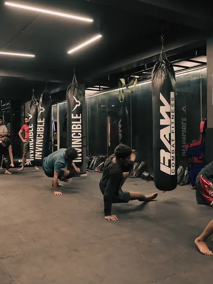 Students practice shrimping and other ground movement drills across the mat, building a solid foundation for Jiu-Jitsu.