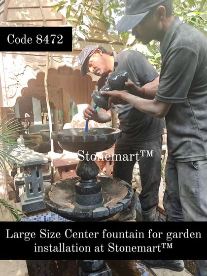 An artisan connects the water pump for the large center fountain. All my fountains come with the necessary pump and are easy to operate.