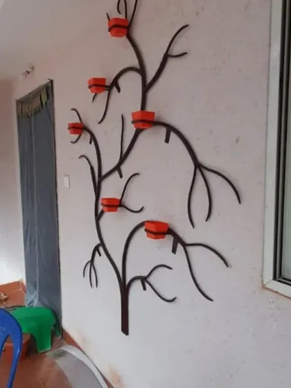 This tree planter was installed on a narrow wall space, showing how vertical gardens can be a great solution for adding greenery even when you don't have a lot of floor space.