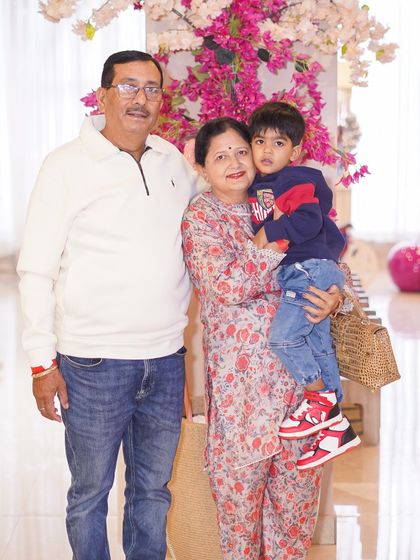 Grandparents posing with their grandson at his birthday party. We create a welcoming environment for guests of all generations to celebrate together.