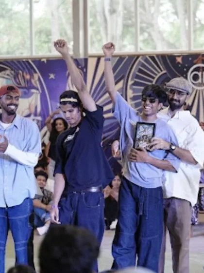 The winner of the 1v1 House battle raises his trophy in victory. Spectra is a chance for our students to shine and be recognized for their hard work.