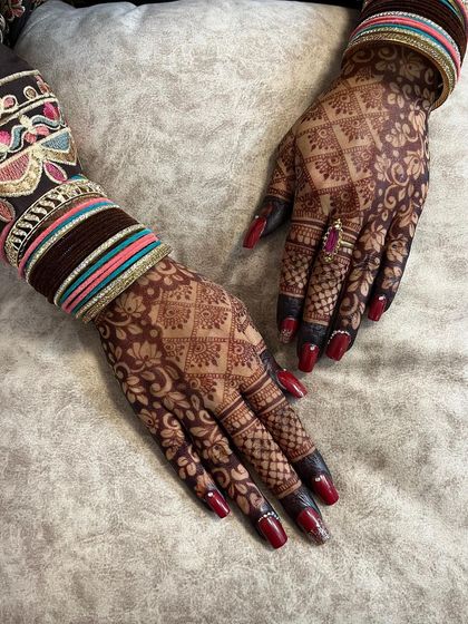 The back-of-hand view of the dark henna stain.