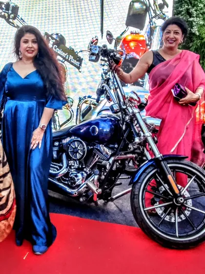 Posing with a friend at Delhi Times Fashion Week. My blue gown stands out with its rich color and flattering silhouette, proving that you can be comfortable and glamorous at the same time.