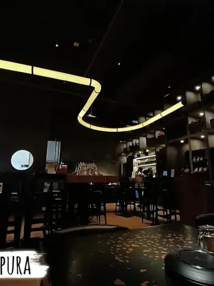 The modern and moody interior of our Kanakapura outlet, with unique lighting fixtures and a sleek design.