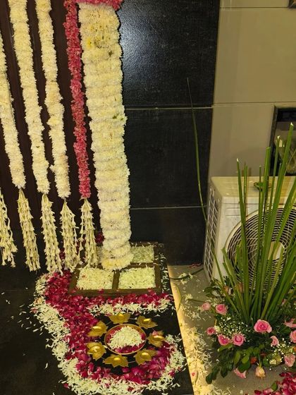 A beautiful floral rangoli and entrance decoration made with jasmine and rose petals for a Diwali celebration.
