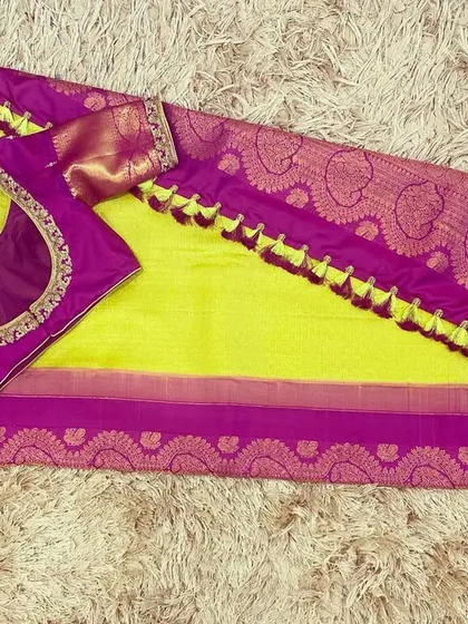 Another view of the magenta purple blouse and neon green saree, a bold and beautiful choice for any celebration.