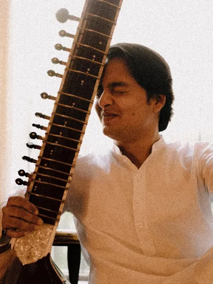 A candid moment of joy, hugging my sitar. This photo captures the love and connection I have with my instrument.