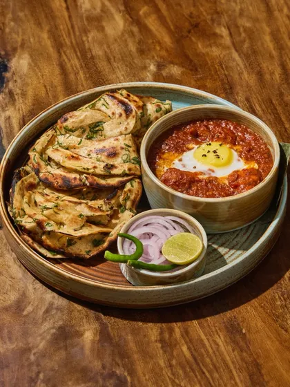 My Tawa Chicken Rara is all heart. I slow-cook succulent chicken in a rich, spiced gravy and serve it with flaky, charred parathas, ready to be torn and dipped.