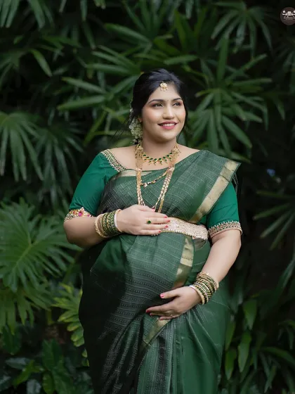 A beautiful solo shot of the expectant mother, highlighting her joy. Outdoor sessions like this allow for soft, natural light that is very flattering for maternity portraits.