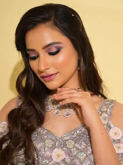 A close-up of the dreamy purple and pink eye makeup. The colors are blended to create a soft, romantic look that is both eye-catching and elegant.