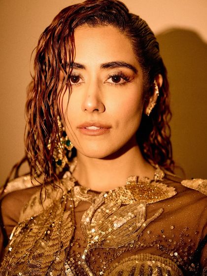 A series of images capturing the stunning Rahul Mishra Couture outfit I styled for Jonita Gandhi's performance. The detailed embroidery, flowing silhouette, and pairing with thigh-high Louboutin boots created a look that was both ethereal and powerful.