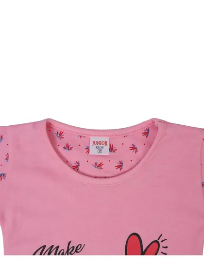 A close up shot of the neckline of a pink kids' t-shirt, showing the fabric detail and brand tag. Detail shots build customer confidence in your product's quality.