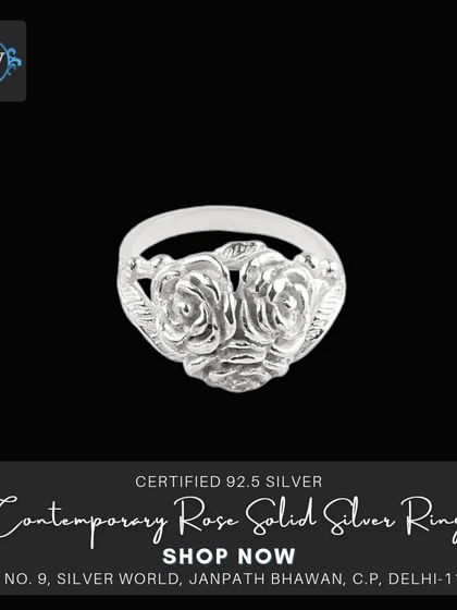 A contemporary solid silver ring featuring two carved roses. This piece is both romantic and modern, perfect for everyday wear.