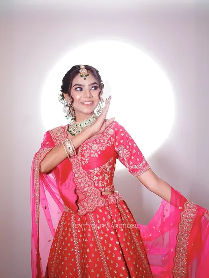 A playful and happy shot in our pink lehenga. It’s great for showing a range of moods in your portfolio, from regal to joyful.