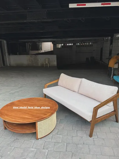 A wide shot of the sofa and coffee table in my workshop parking area.