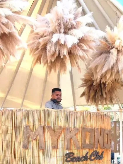 At the Mykonos Beach Club in Turkey for a destination wedding event. I adapt my style to fit the vibe of the location, from beach clubs to elegant ballrooms.