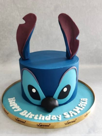 A cute and simple Stitch-themed cake. I love how the character's face is the main focus, with his big ears popping out from the top.