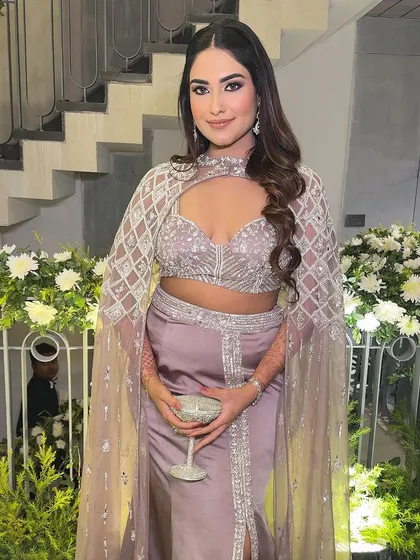 The perfect party look. The combination of the smokey eye, glowing skin, and stunning outfit is a guaranteed head-turner.