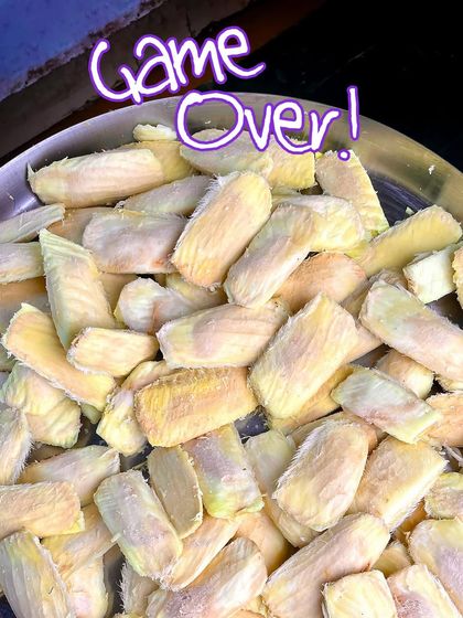 Game over for these mangoes! A tray full of peeled mango seeds, ready for the next stage of our pickle-making process.
