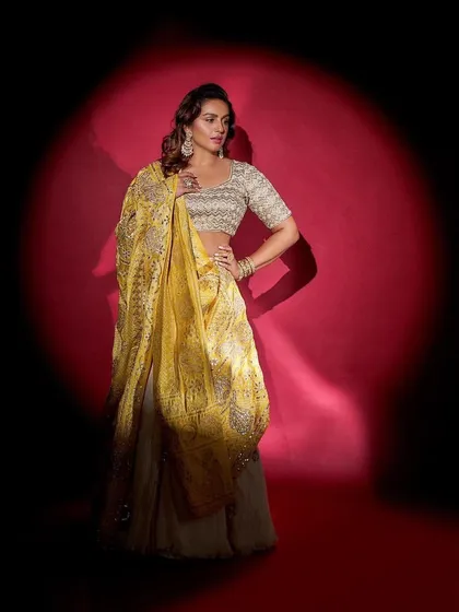 Another angle of the stunning Faabiiana lehenga, showing its elegant silhouette and the beautiful contrast between the embroidered blouse and the flowing skirt.