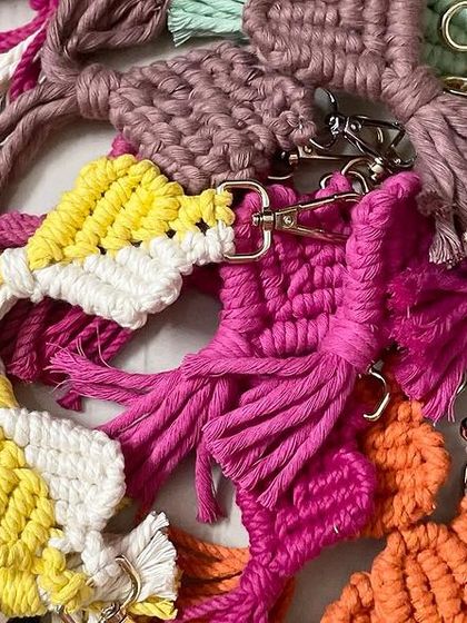 A colorful pile of my handmade keychains, ready to be packed. It shows the variety of styles and colors I work with.