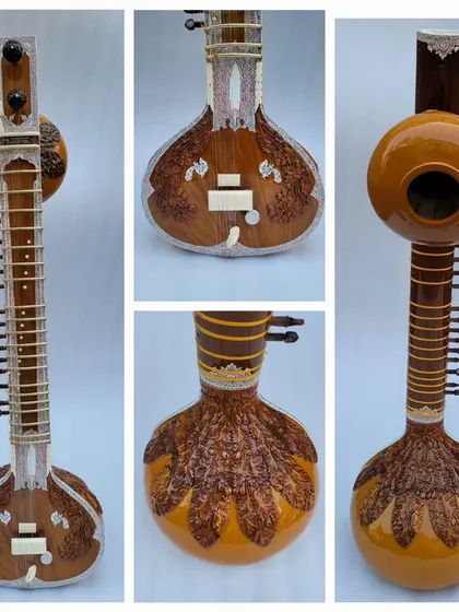 This is a classic Pandit Ravi Shankar style sitar, made from high-quality teakwood. You can see the detailed craftsmanship in the woodwork and the traditional fittings, all designed for a deep and resonant sound.