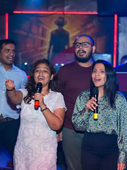 This is what it's all about. A group of friends sharing a mic, singing their favorite song together. My karaoke nights are designed to bring people together and create these moments of pure joy and connection.