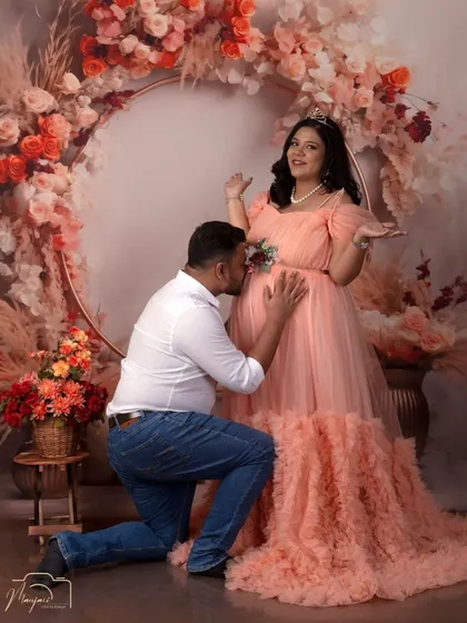 The classic bump kiss, always a favorite. This pose beautifully captures the partner's love and anticipation for the new arrival.