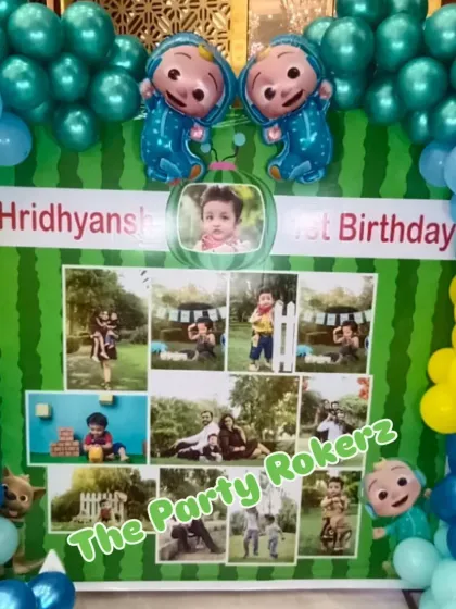 A personalized Cocomelon backdrop featuring a photo collage of the birthday boy's first year. It's a sweet and personal touch for a first birthday.