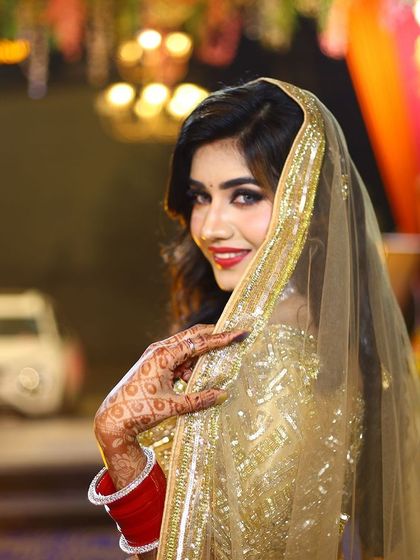 A beautiful portrait of my reception bride, with her golden veil framing her face. She looks like a movie star.