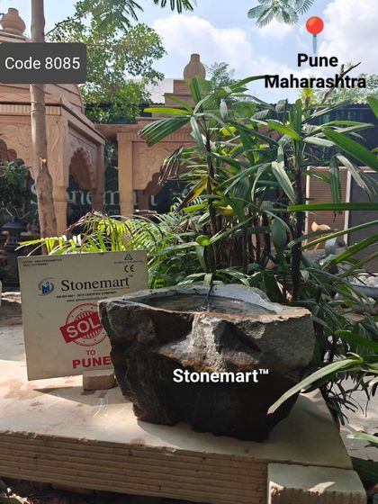 This natural rock bubbler fountain, sold to a client in Pune, is displayed one last time before being packed.