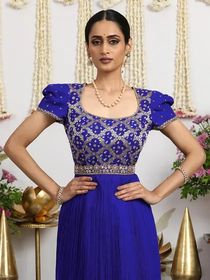 A close-up of the puff-sleeved blouse, a unique and fashionable detail that sets this gown apart.