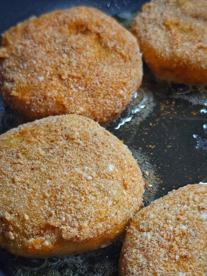 Tikkis getting that perfect golden-brown crust as they pan-fry. These were a part of my festive menu, adding a delicious crunch to the celebration.