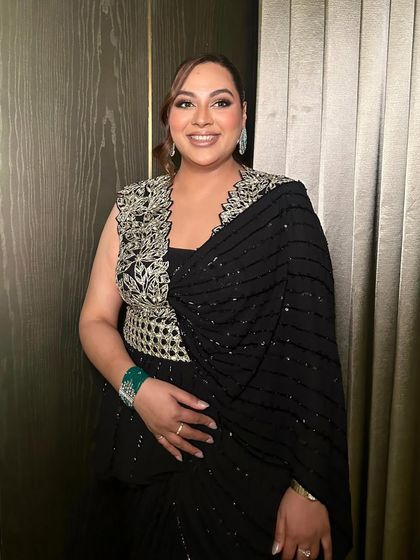 A smiling shot of this cocktail glam, showing how the makeup looks both beautiful and natural, even with a defined eye.