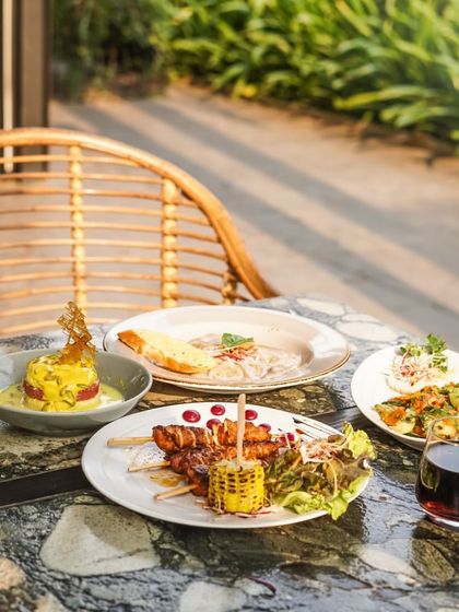 A close-up of the delicious spread, bathed in golden sunlight, making the food look even more appetizing.