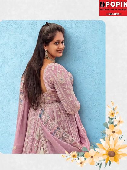 A side profile of the lavender bridal lehenga, showcasing the intricate details and the elegant fall of the skirt. It’s a look that is both modern and timeless.