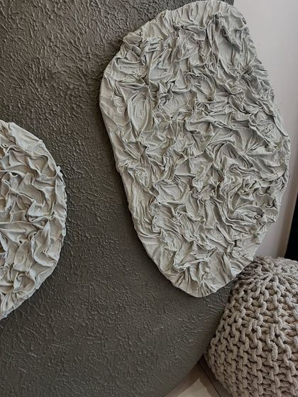 A close-up of the ruffled texture. This effect is created by meticulously sculpting fabric onto the board before painting, resulting in a unique and highly detailed 3D element.